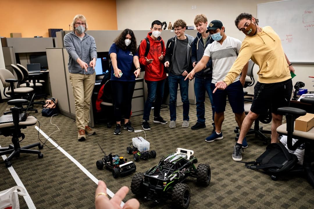 Mentoring students testing autonomous RC vehicles for the F1TENTH program